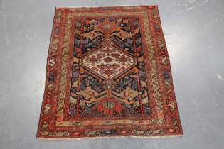 A small Hamadan rug, North-west Persia, early 20th century, the charcoal field with an ivory stepped