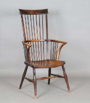 A mid-19th century provincial ash and elm bar and stick back Windsor armchair with a wide elm seat