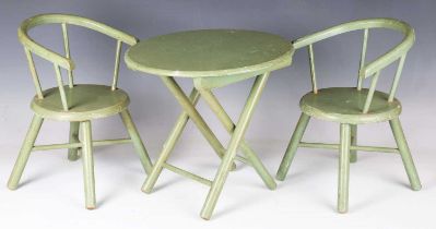 A mid-20th century green painted folding doll's table and two matching tub back chairs, width 23cm.