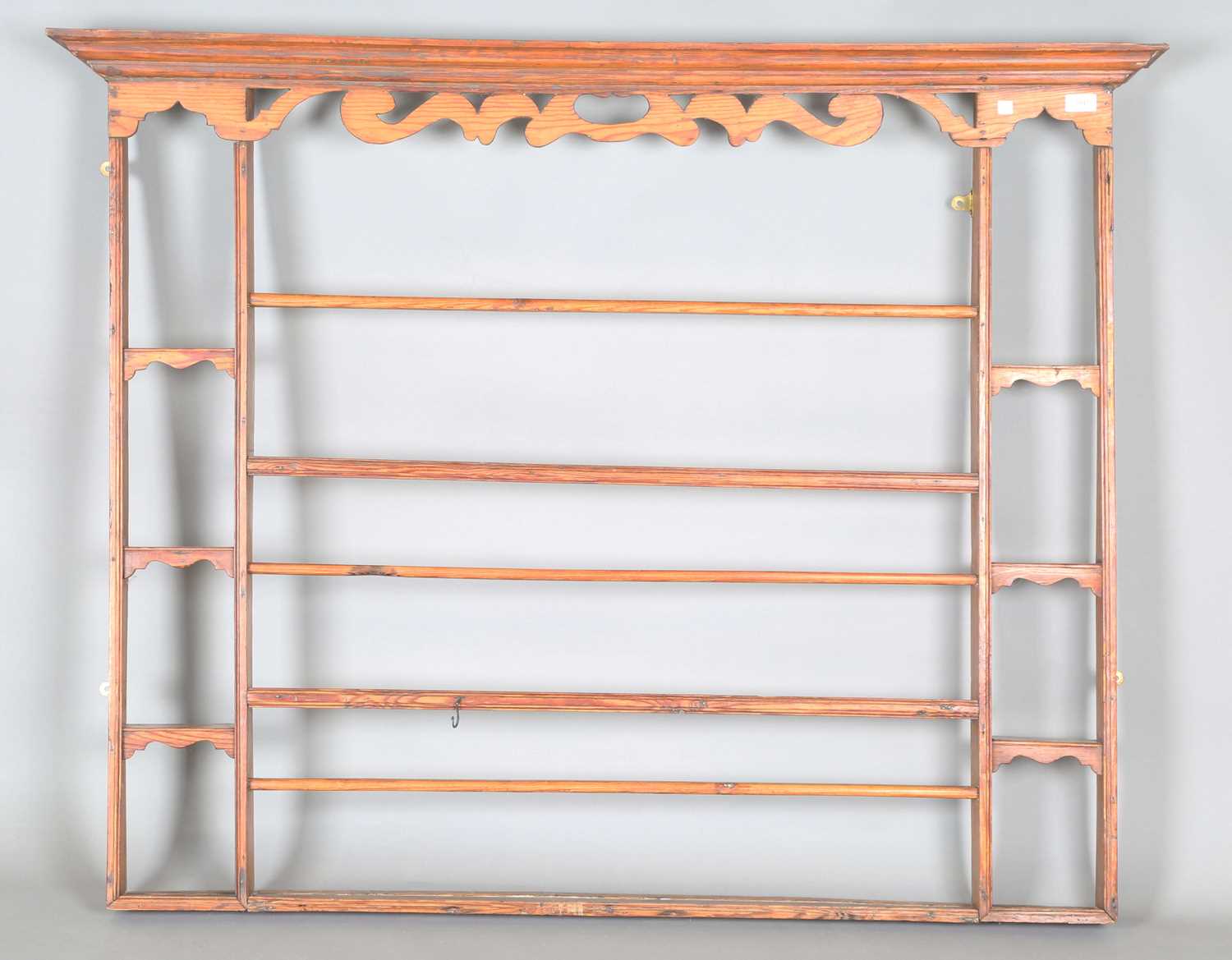 An 18th century provincial pine plate rack with pierced frieze, height 112cm, width 140cm, depth