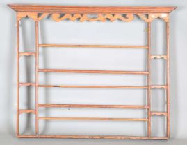 An 18th century provincial pine plate rack with pierced frieze, height 112cm, width 140cm, depth