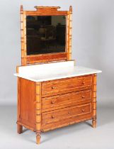 A late 19th century French pitch pine and faux bamboo dressing chest with mirror back and marble