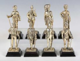 A set of eight late 20th century gilt cast metal military figures, depicting soldiers of various