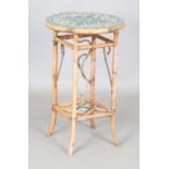 A late 19th century bamboo two-tier occasional table, the top inset with Isnik style glazed