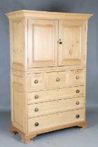 A 20th century Georgian style pine housekeeper's cupboard, fitted with two doors above six