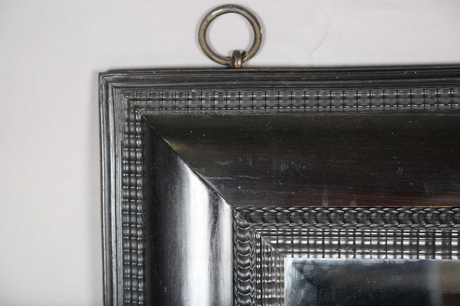A late 19th century ebonized mirror, the bevelled plate within a Dutch ripple wide section frame, - Image 2 of 8