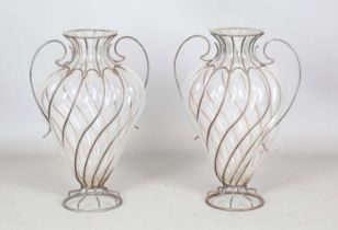 A pair of late 20th century wrought wire and blown clear glass vases, height 62cm.