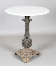 A 19th century French cast iron table base with later white marble top, height 78cm, diameter 69cm.