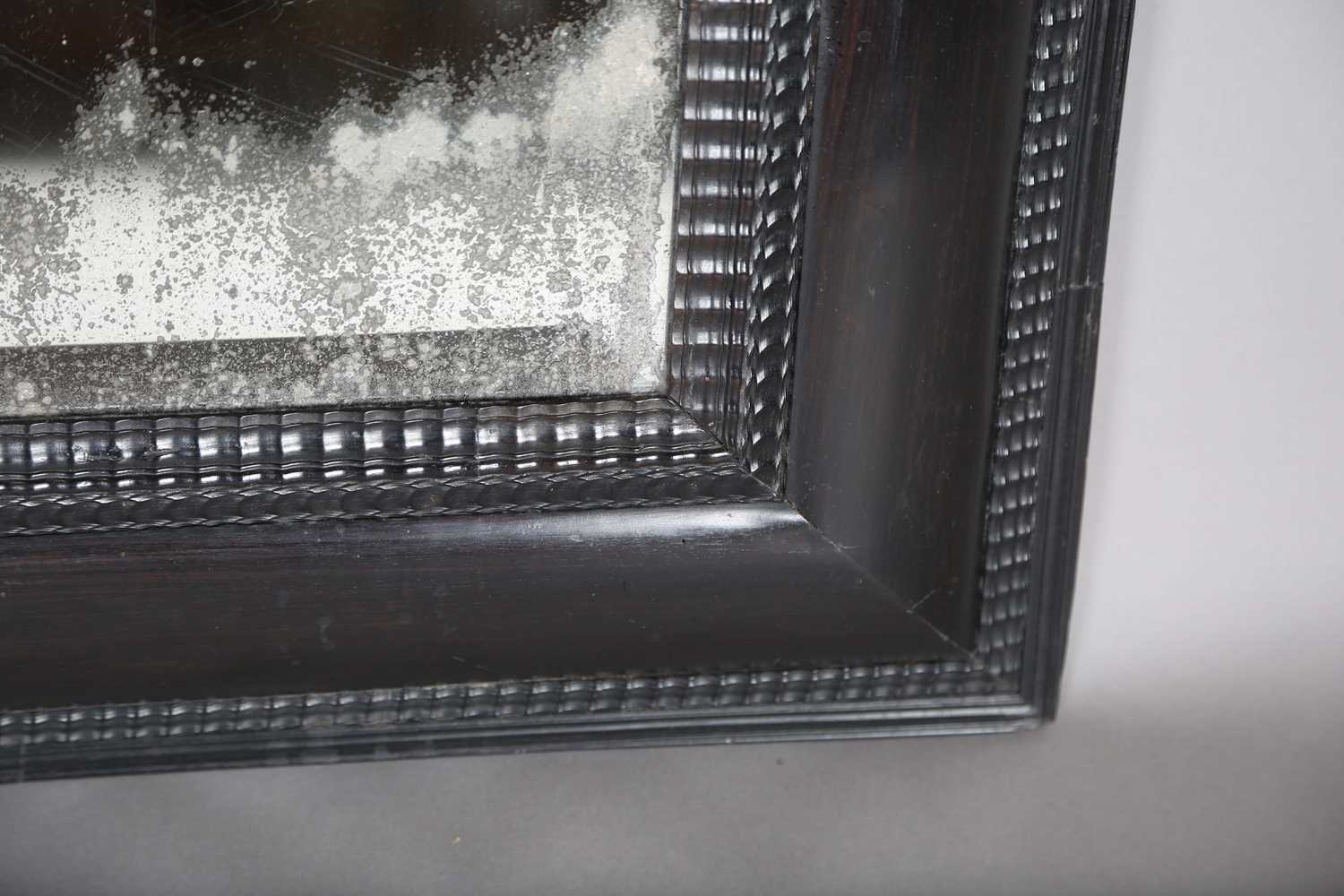 A late 19th century ebonized mirror, the bevelled plate within a Dutch ripple wide section frame, - Image 5 of 8