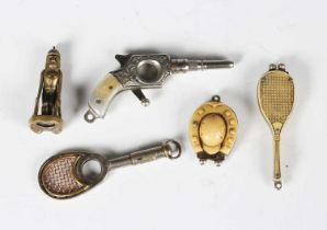 A group of five early 20th century novelty fob cigar cutters, including two in the form of tennis