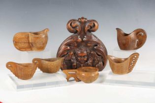 A group of five mid-20th century Balcan carved wooden cups, together with a 19th century carved