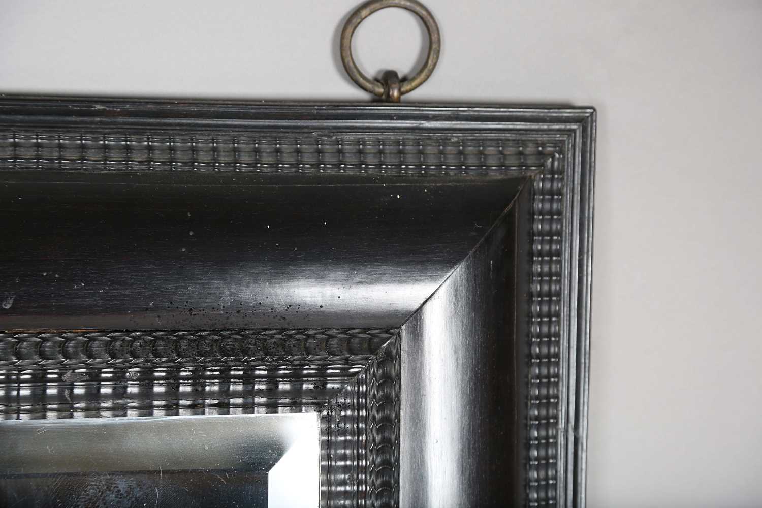 A late 19th century ebonized mirror, the bevelled plate within a Dutch ripple wide section frame, - Image 4 of 8