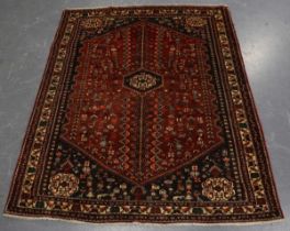 An Abadeh rug, South-west Persia, late 20th century, the dark terracotta field with a pole