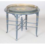 A 19th century tole painted tin circular tray-topped table, painted with a portrait of a lady and