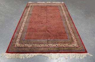 A Serrabend carpet, North-west Persia, late 20th century, the red field with overall offset boteh,