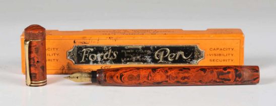 A rare T.B. Ford red/black mottled hard rubber cased 'Standard' fountain pen, the nib detailed 'Ford
