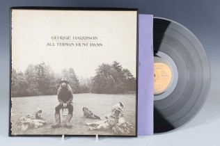 A collection of fifteen LP records, including a U.S. pressing of 'All Things Must Pass' by George