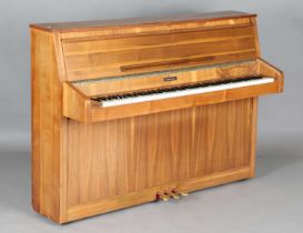 A late 20th century walnut cased upright piano by Baldwin, serial number '051430', height 103cm,