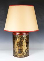 A 19th century tole painted tea canister, converted to a table lamp, later decorated with gilt