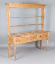 An 18th century provincial pine dresser, the base fitted with three drawers, height 188cm, width