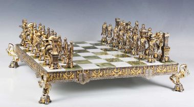 A mid/late 20th century gilt and silvered cast bronze chess set and board by Piero Benzoni, each