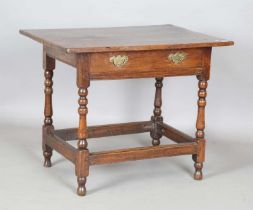 A Charles II oak side table, fitted with a single frieze drawer, on turned and block legs, height