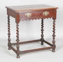 A 17th century and later oak side table, the legs with carved foliate knops, height 78cm, width