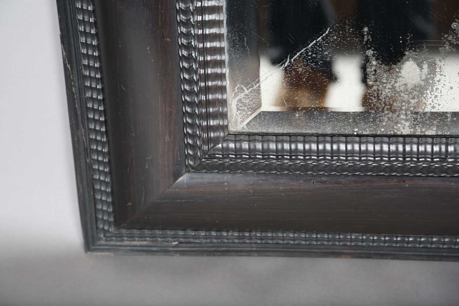 A late 19th century ebonized mirror, the bevelled plate within a Dutch ripple wide section frame, - Image 6 of 8