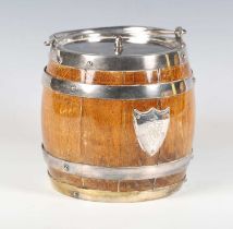 A late Victorian oak and plate mounted ice bucket, the front with applied heraldic crest plaque,