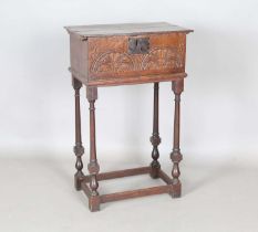 A late 17th century oak bible box, the sides carved with lunettes, raised on a later stand, height