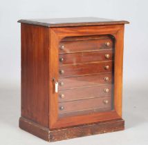 A late Victorian mahogany and stained pine table-top collector's chest, fitted with a glazed door