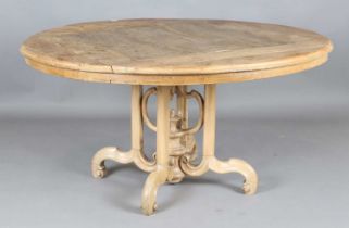 A 19th century and later pine circular breakfast table, raised on scroll legs, height 78cm, diameter