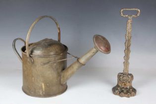 A late Victorian cast brass doorstop with hairy claw foot, height 36cm, together with an early