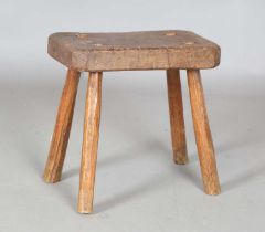 A 19th century elm seated rustic hearth stool with staked legs, height 37cm, width 37cm, depth