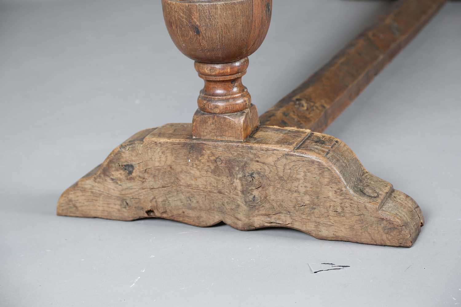 A 17th century style oak refectory table, the top with a walnut crossbanded border, height 74cm, - Image 9 of 17