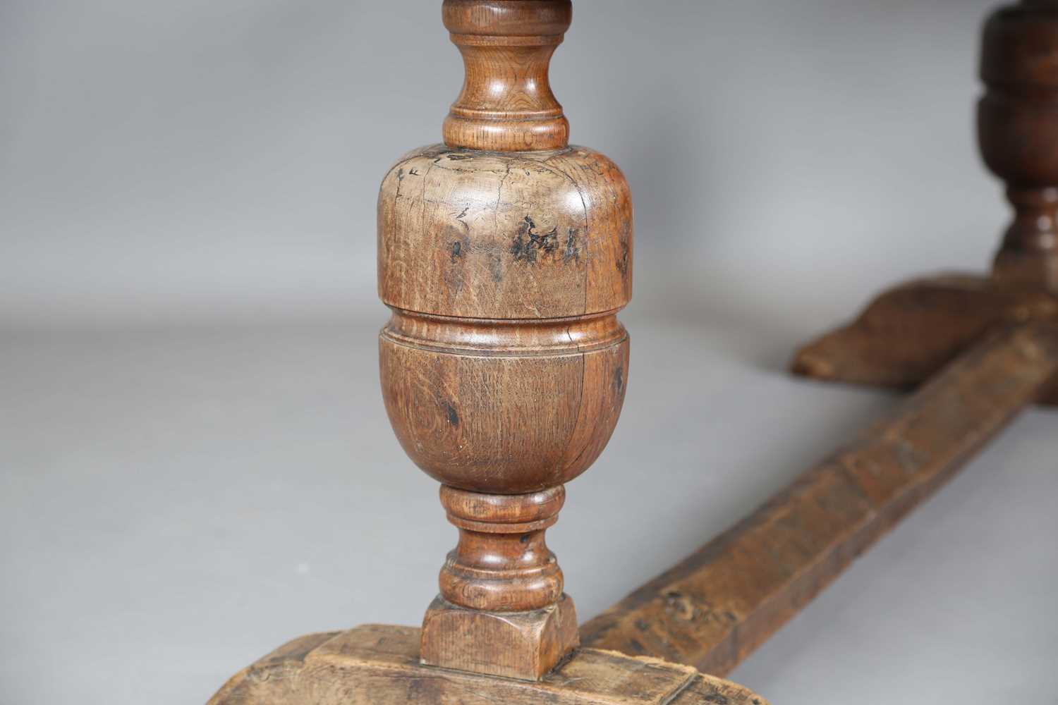 A 17th century style oak refectory table, the top with a walnut crossbanded border, height 74cm, - Image 8 of 17