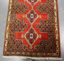 A Senneh runner, South-west Persia, mid/late 20th century, the burnt orange field with a single
