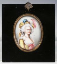 A 19th century painted porcelain portrait miniature of a lady wearing a feather-embellished hat, 8cm