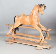 A 19th century pine rocking horse, height 120cm, length 153cm.