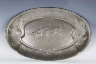 A late 19th/early 20th century Kayserzinn pewter oval platter, decorated in relief with a running