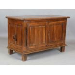 An 18th century Continental oak side cabinet, fitted with two panelled doors, height 87cm, width
