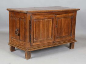 An 18th century Continental oak side cabinet, fitted with two panelled doors, height 87cm, width