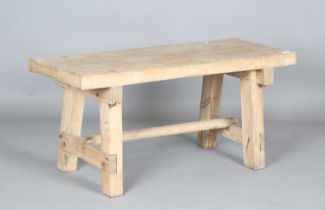 A late 19th century pine pig bench, on block legs, height 50cm, length 108cm, depth 44cm.