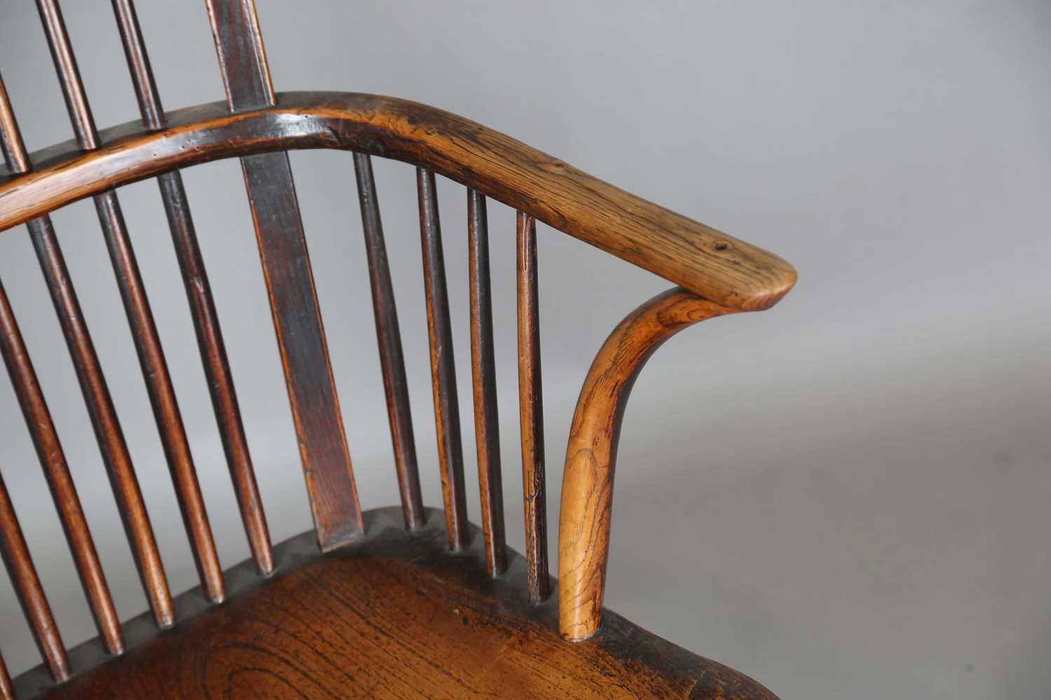 A mid-19th century provincial ash and elm bar and stick back Windsor armchair with a wide elm seat - Image 5 of 9