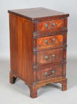 A George III and later mahogany pedestal chest of three drawers with applied cast metal handles,