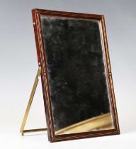 A 19th century rosewood and brass inlaid travelling vanity case mirror with folding strut back and