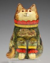 A Joan and David De Bethel Rye Pottery Christmas cat, dated 1995, with découpage figures against a