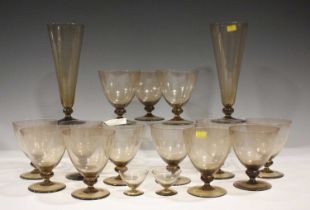 An Orrefors Astrid pattern part suite of glassware, designed by Simon Gate, in cinnamon glass,