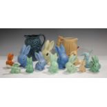 A group of mostly Sylvac pottery rabbits, including an orange glazed example, No.1067, height