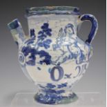 A Savona maiolica syrup or wet drug jar, early 18th century, painted in blue with two winged cherubs